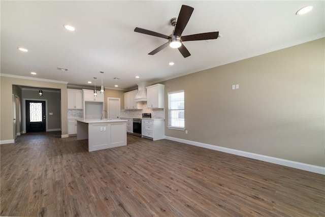 kitchen featuring a center island, dark wood-type flooring, stainless steel electric stove, white cabinets, and decorative light fixtures