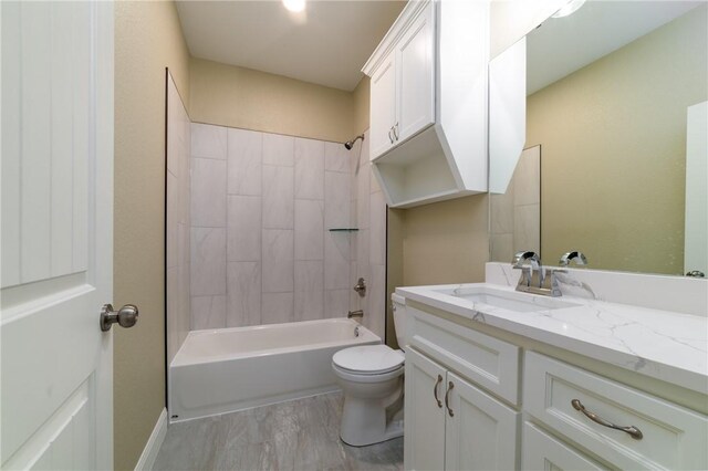 full bathroom with hardwood / wood-style flooring, toilet, vanity, and tub / shower combination