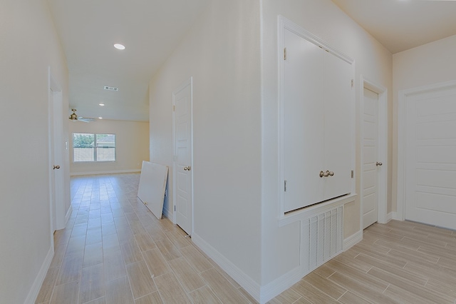 corridor featuring light hardwood / wood-style floors