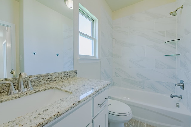 full bathroom featuring vanity, toilet, and tiled shower / bath