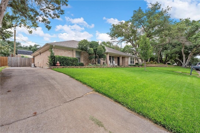 ranch-style house with a front lawn