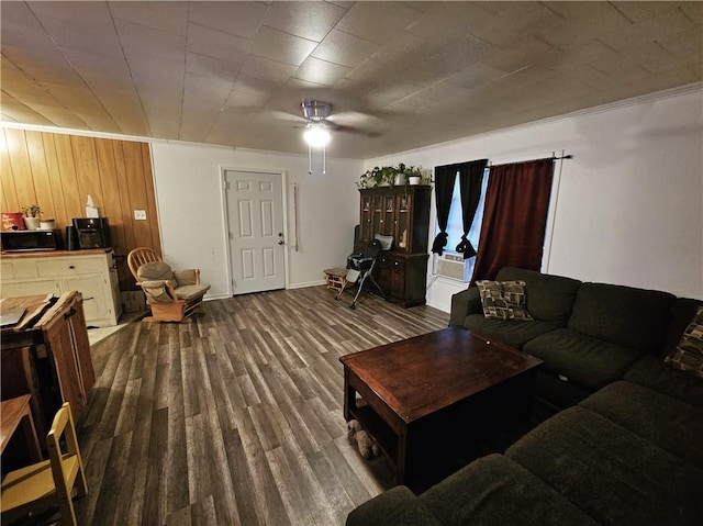 living room featuring ceiling fan and hardwood / wood-style floors