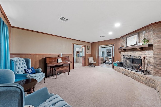 carpeted living room featuring ornamental molding, a fireplace, and wood walls