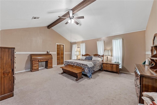 bedroom featuring vaulted ceiling with beams, light colored carpet, and ceiling fan