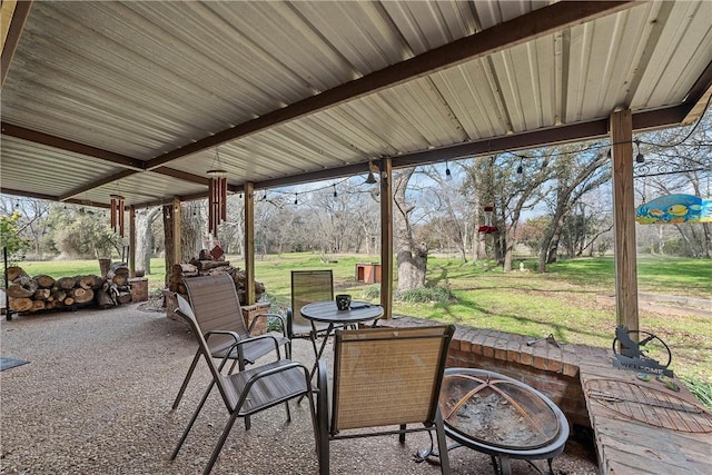 view of patio with a fire pit