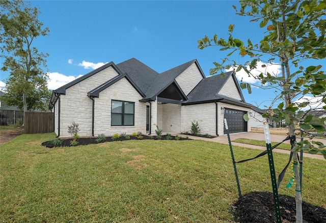 view of front of home with a garage and a front yard