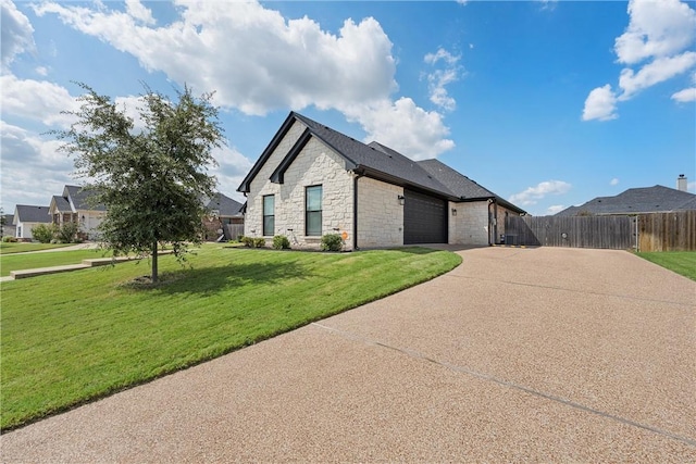 view of front facade with a front yard and a garage