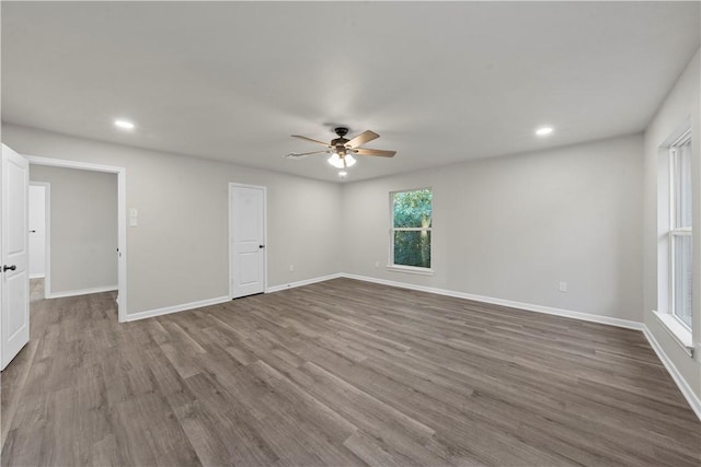 unfurnished room with wood-type flooring and ceiling fan