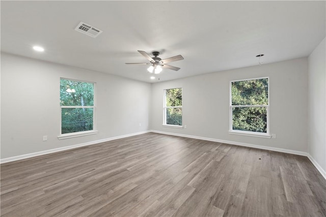 unfurnished room featuring ceiling fan and light hardwood / wood-style flooring