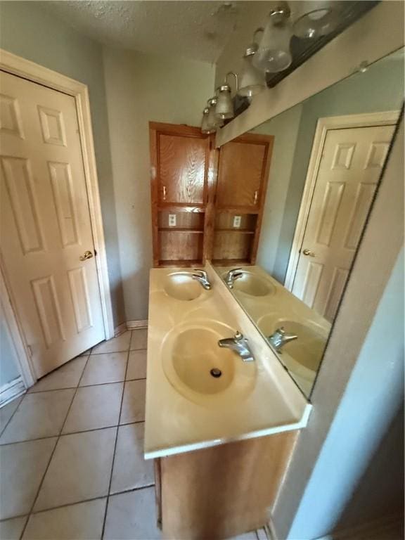 bathroom with tile patterned floors and sink