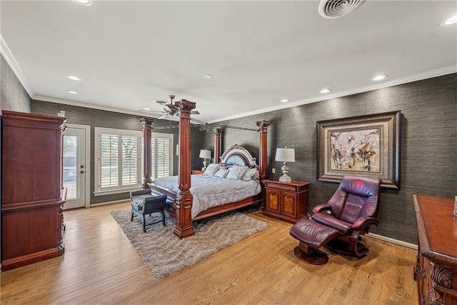 bedroom featuring light hardwood / wood-style flooring, ceiling fan, and crown molding