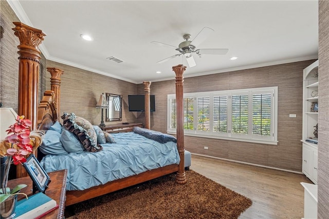 bedroom featuring wood-type flooring, ceiling fan, and crown molding