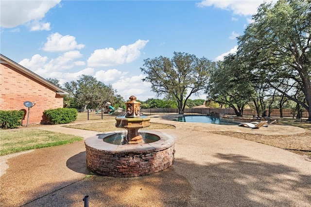 view of patio featuring a fenced in pool