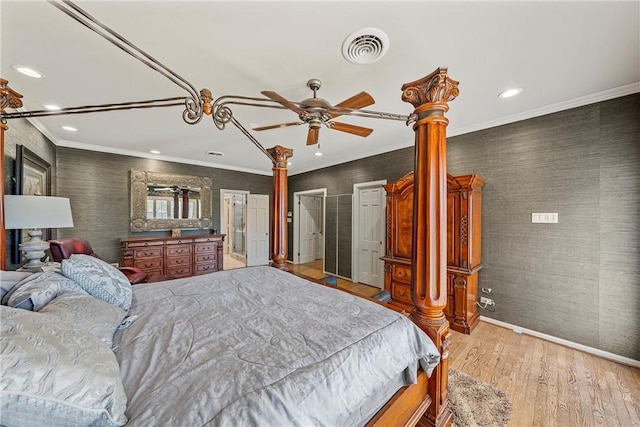 bedroom with ceiling fan, light hardwood / wood-style floors, and crown molding