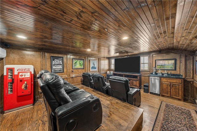 cinema featuring light wood-type flooring, an AC wall unit, wooden walls, and wood ceiling