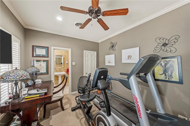 workout area featuring light colored carpet, ceiling fan, and crown molding