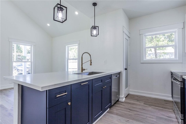 kitchen featuring lofted ceiling, stainless steel appliances, a healthy amount of sunlight, and sink