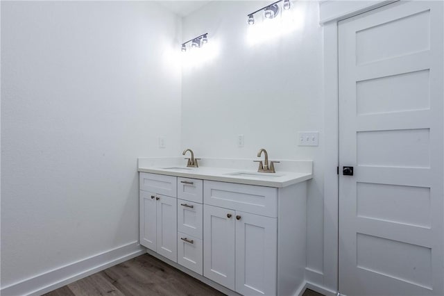 bathroom featuring wood-type flooring and vanity