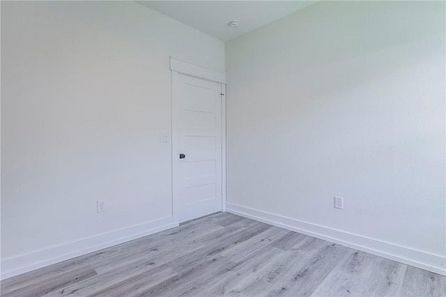 unfurnished room featuring light hardwood / wood-style floors