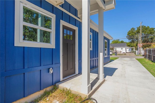 doorway to property with a porch