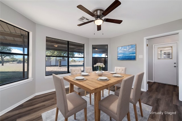 dining area with dark hardwood / wood-style flooring, a wealth of natural light, and ceiling fan