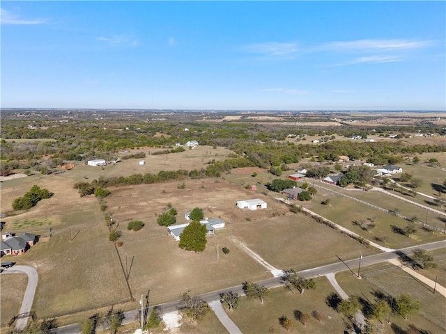 birds eye view of property with a rural view