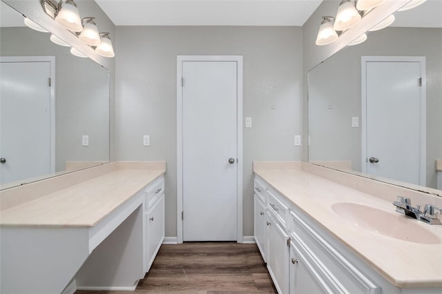 bathroom featuring hardwood / wood-style floors and vanity