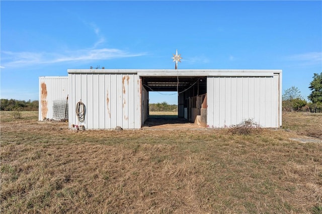 view of outbuilding with a yard