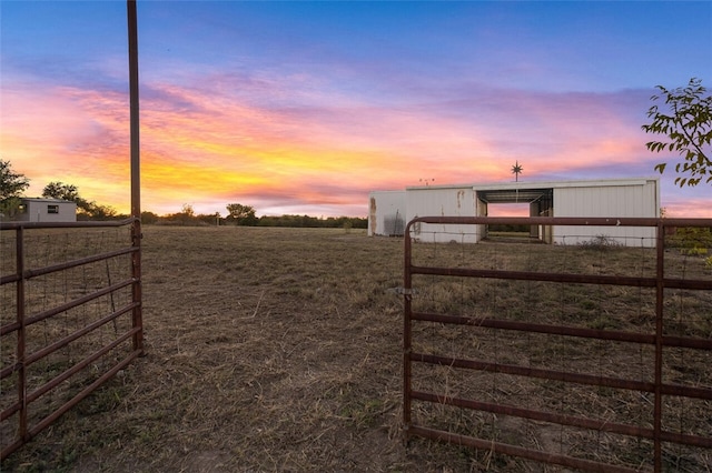 yard at dusk with an outdoor structure