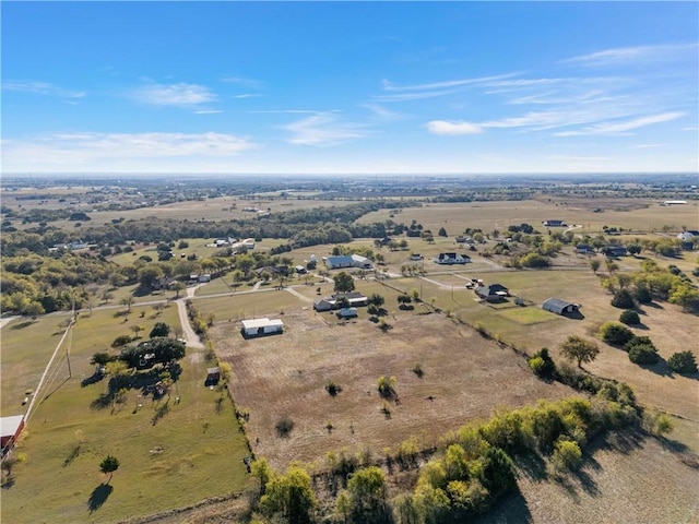 birds eye view of property with a rural view