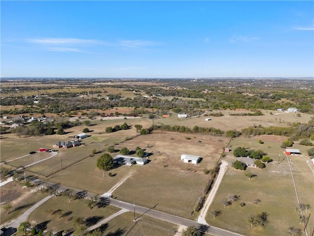 birds eye view of property with a rural view