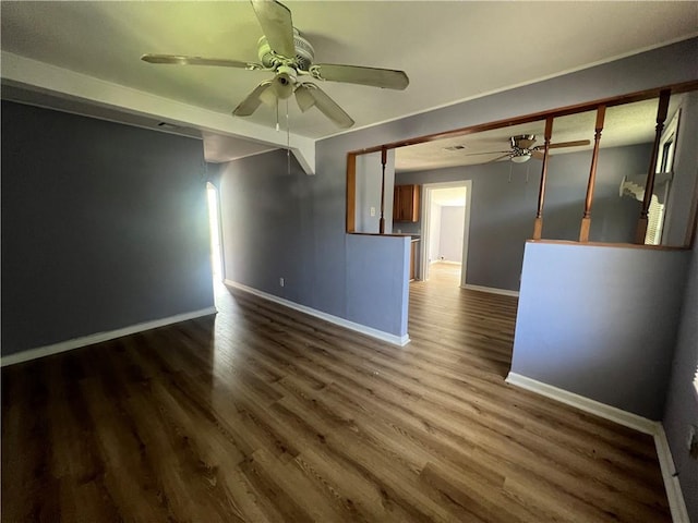 empty room featuring dark hardwood / wood-style floors and ceiling fan