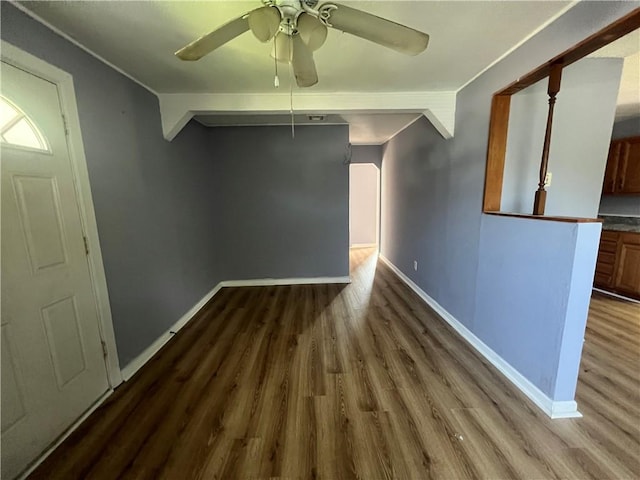 interior space with ceiling fan and wood-type flooring