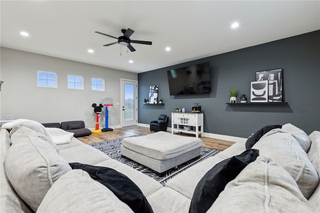 living room with recessed lighting, ceiling fan, baseboards, and wood finished floors