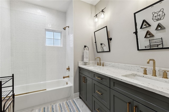 full bathroom featuring bathtub / shower combination, a sink, and double vanity