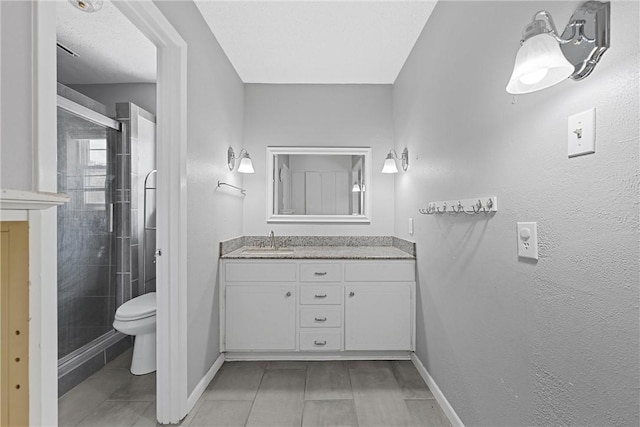 bathroom with an enclosed shower, vanity, and toilet