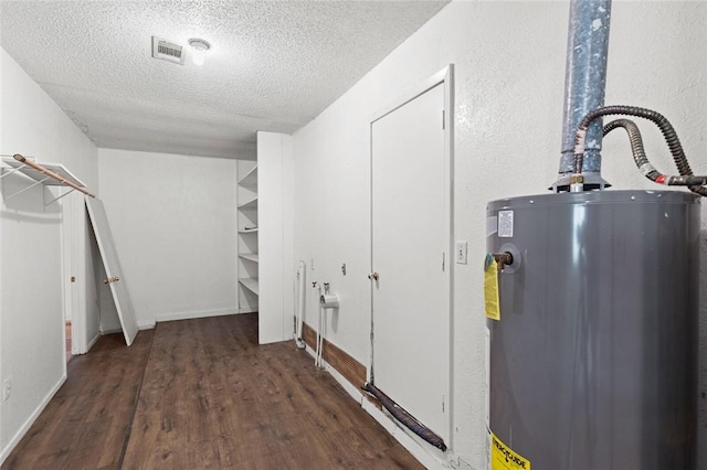 utility room with gas water heater