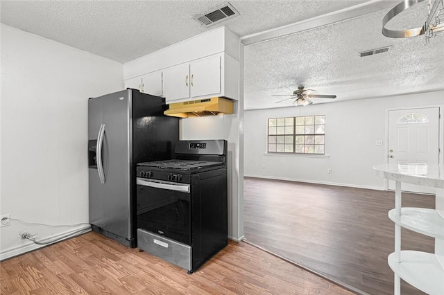 kitchen featuring ventilation hood, white cabinets, black range with gas stovetop, ceiling fan, and light hardwood / wood-style floors