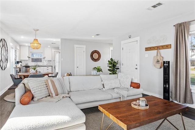 living room featuring a healthy amount of sunlight and hardwood / wood-style floors