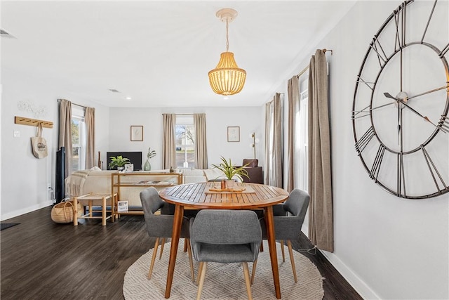 dining area featuring dark hardwood / wood-style floors