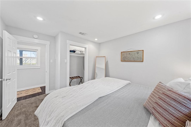 bedroom featuring dark carpet