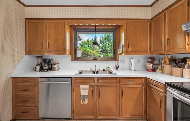 kitchen featuring sink, ornamental molding, stainless steel appliances, and hanging light fixtures