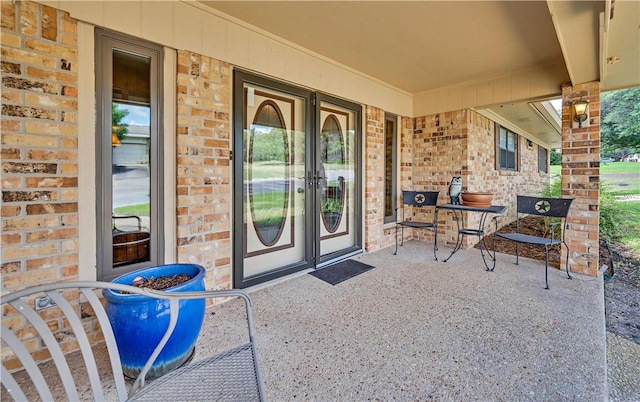 view of exterior entry with covered porch