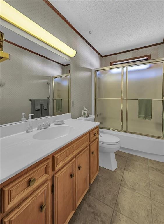 full bathroom featuring crown molding, a textured ceiling, toilet, shower / bath combination with glass door, and vanity