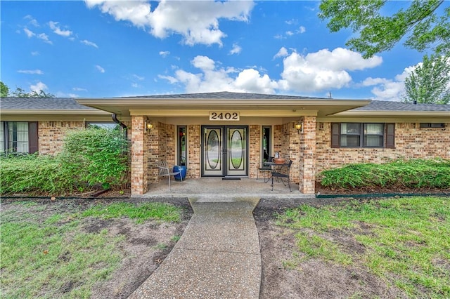 doorway to property with a porch