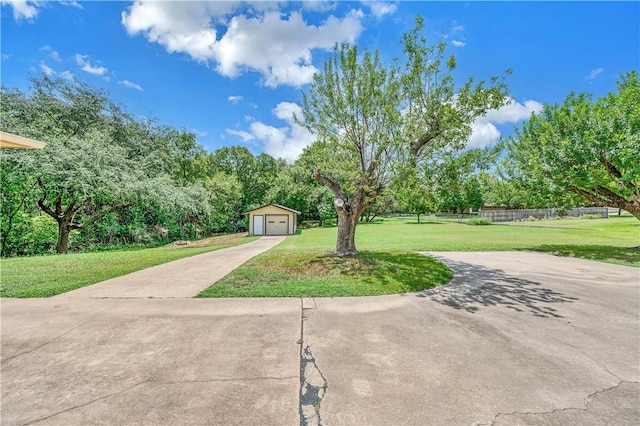 view of yard with an outdoor structure and a garage