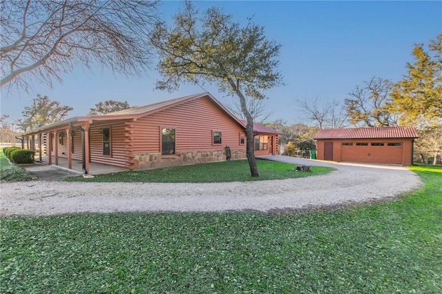 view of side of home featuring a carport and a yard