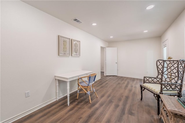 living area with dark hardwood / wood-style floors