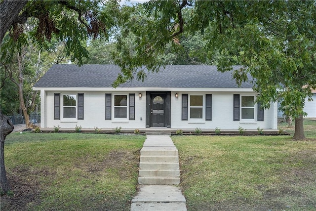 ranch-style house featuring a front lawn