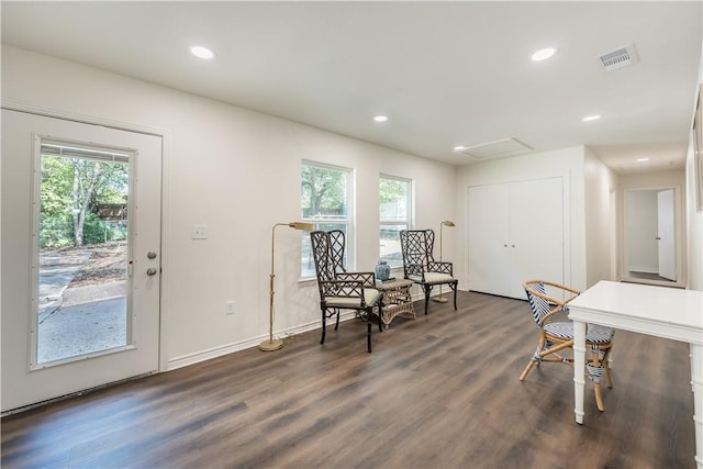 sitting room with dark hardwood / wood-style flooring